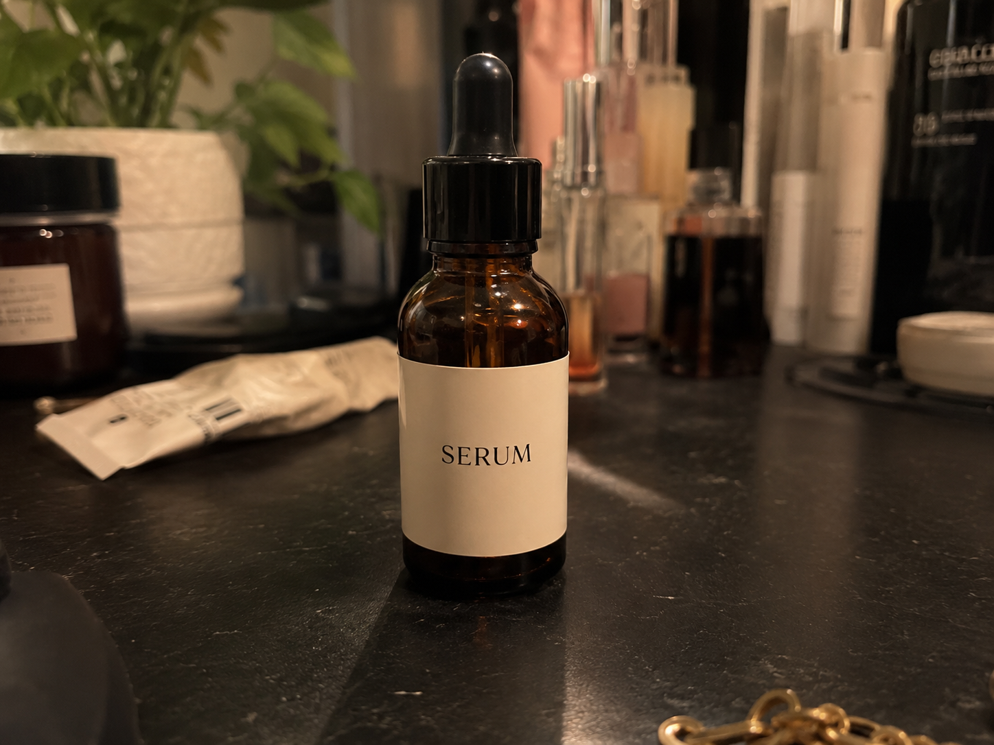 Source serum bottle on a cluttered counter
